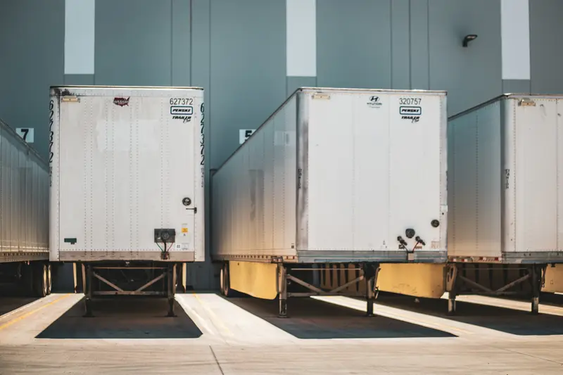 Trailers backed up to loading docks at a distribution center